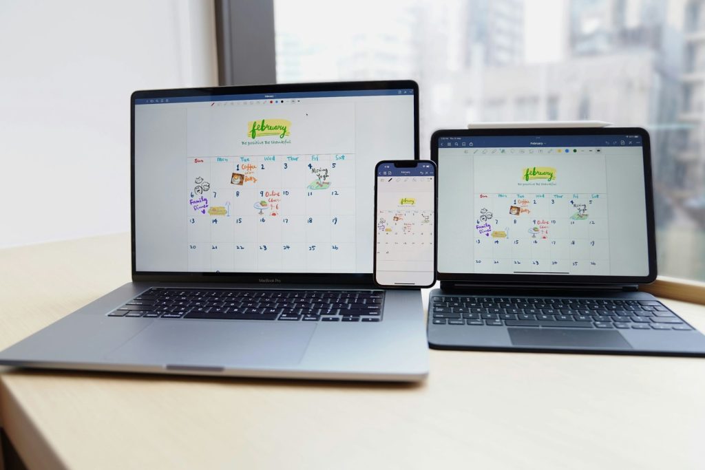 a couple of laptops on a table